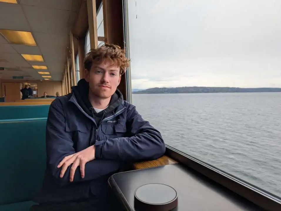 Alex Murdock riding a ferry in Washington state.